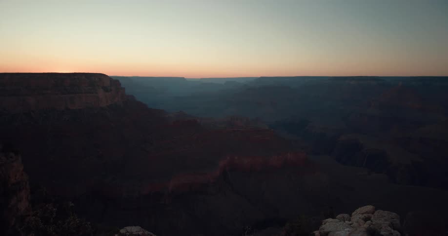 A vast arid canyon in the evening