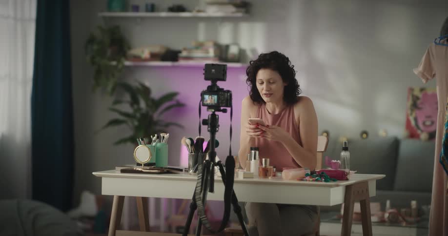 A woman is recording herself talking about makeup