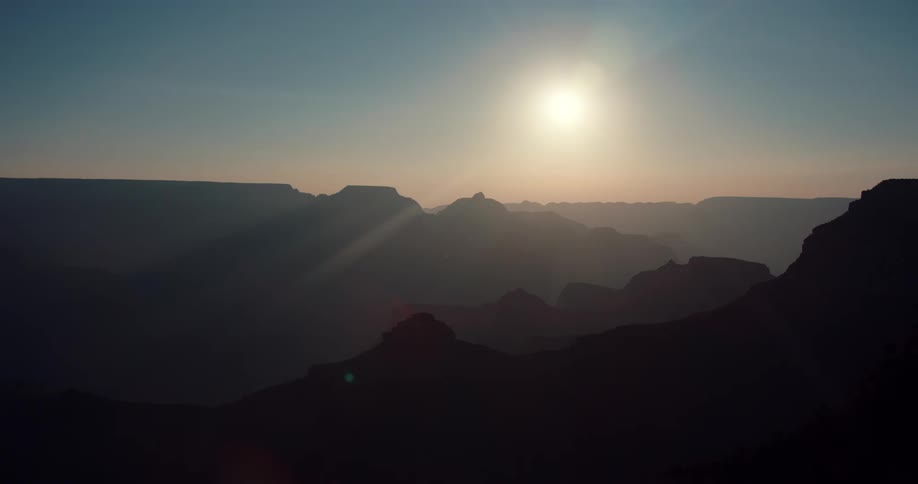 The sun is rising over the mountain range