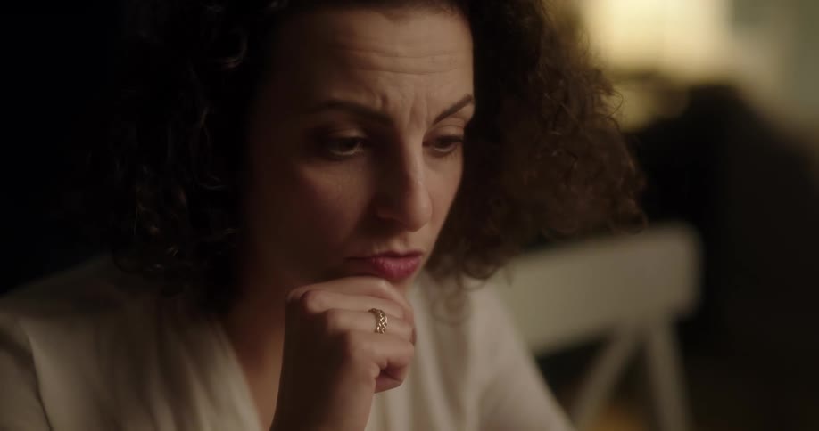 A woman is thinking something over