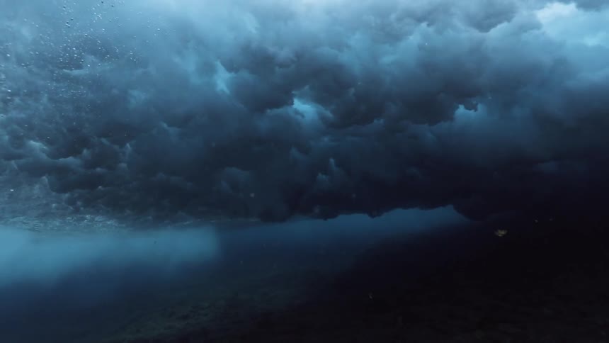 Underwater footage of waves breaking overhead