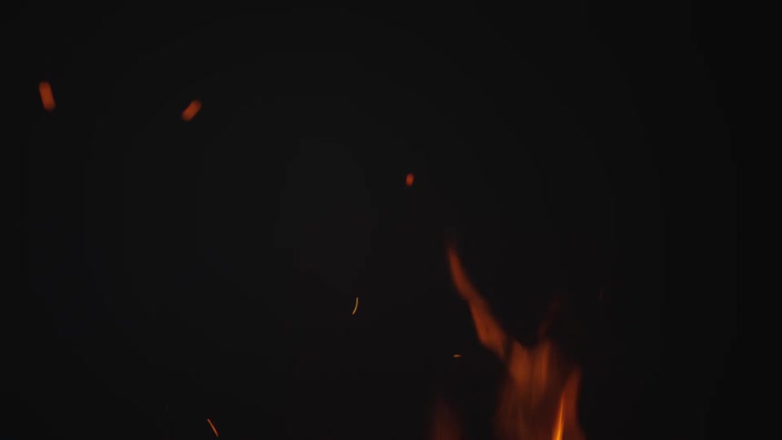 The campfire is burning at night
