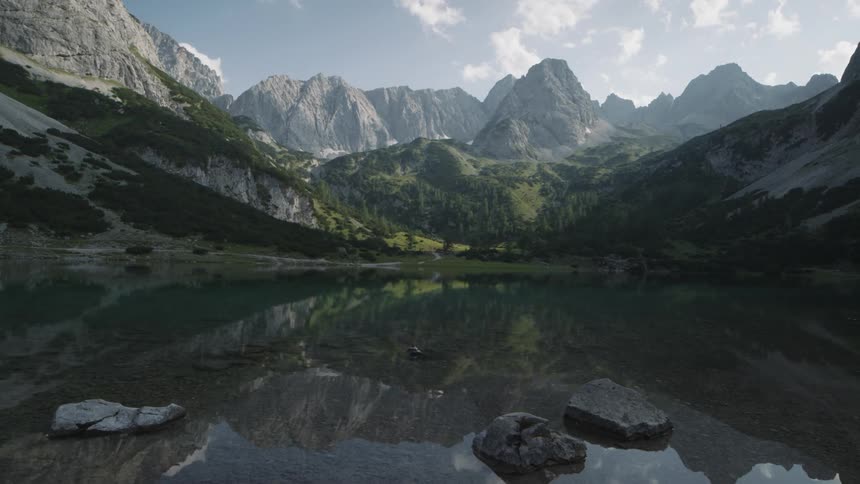 The clouds flow over the lake