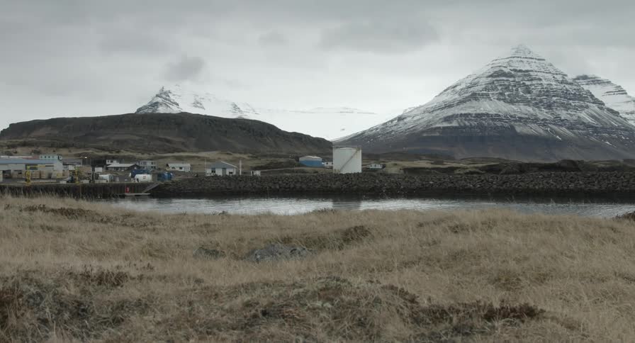 Small industrious area at the foot of mountains
