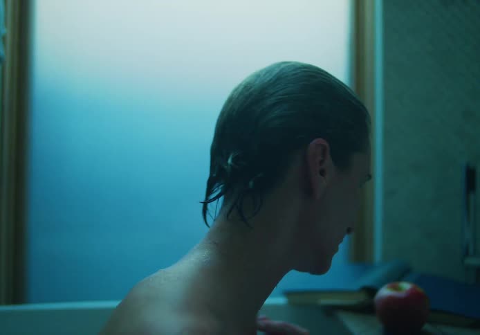 A woman is washing in a bath