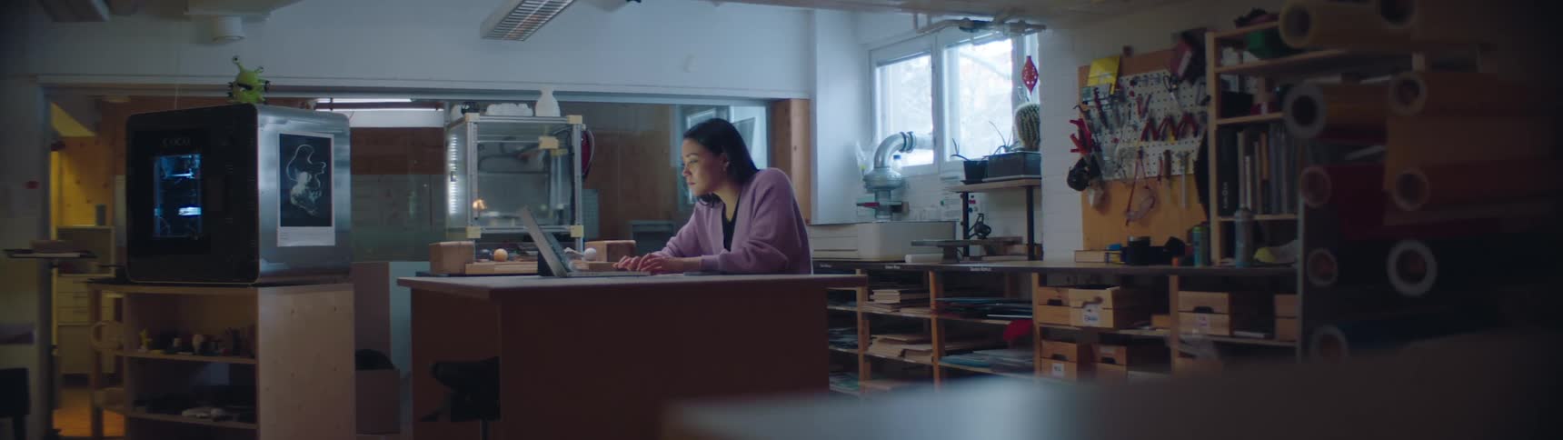 A woman is working on her laptop