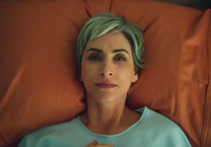 A woman is resting in bed