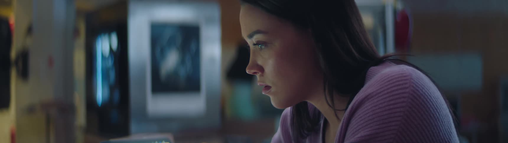 Woman quickly writing an idea down on her computer