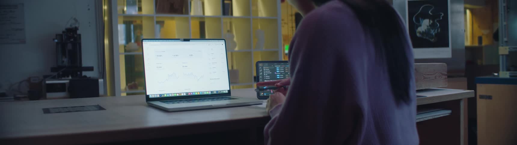 A woman is typing on a laptop in her home