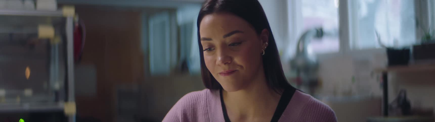 A woman is talking and smiling