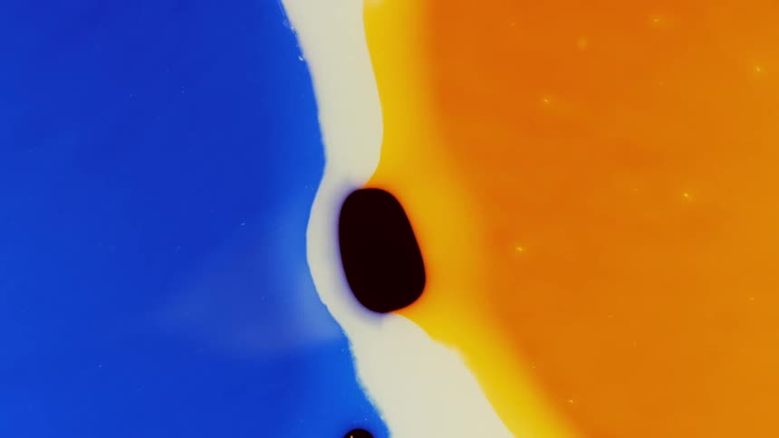 Blue orange and white colors melt together to create patterns