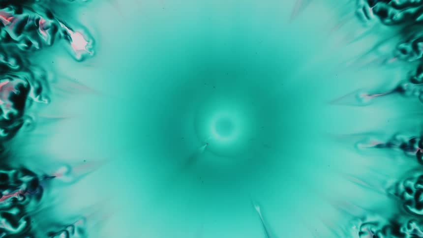 A circle of teal explodes and expands glowing bright