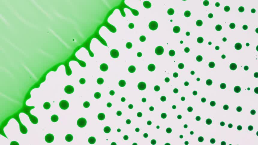 A green chemical substance creates dots and moves