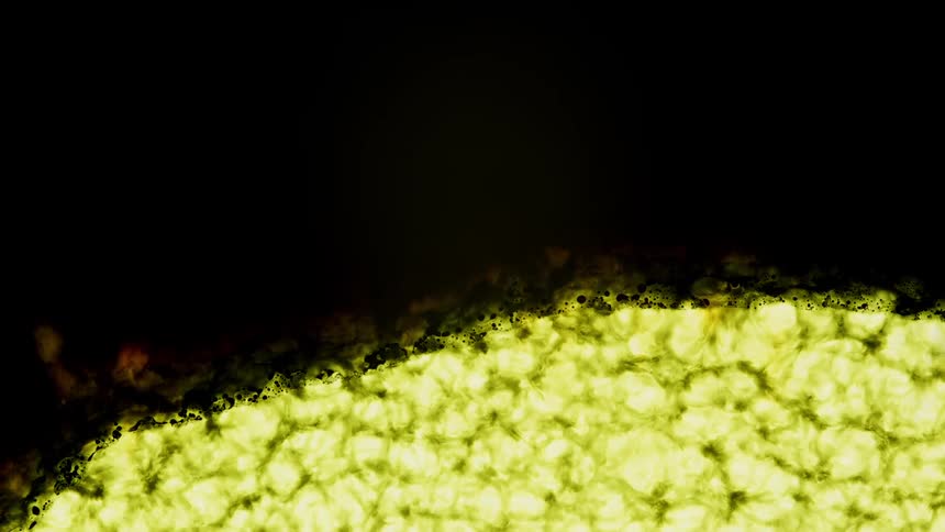A dark wave of dye flows and covers bright yellow