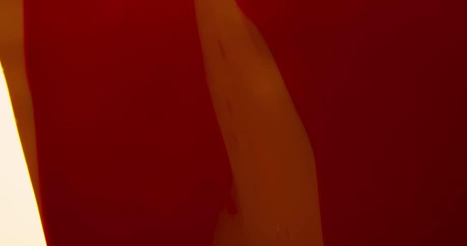 Flowing red orange liquid