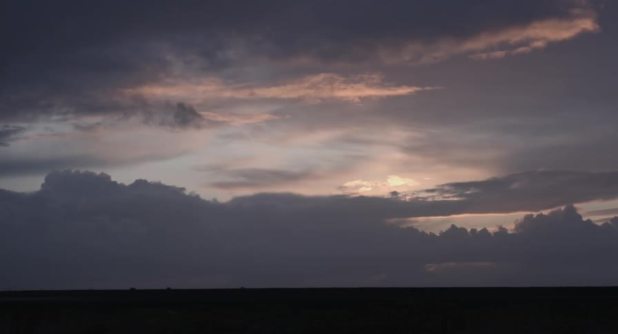 Large clouds in the sky at dusk