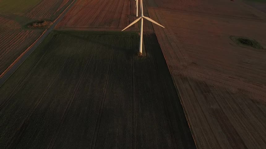 Three large spinning wind turbines