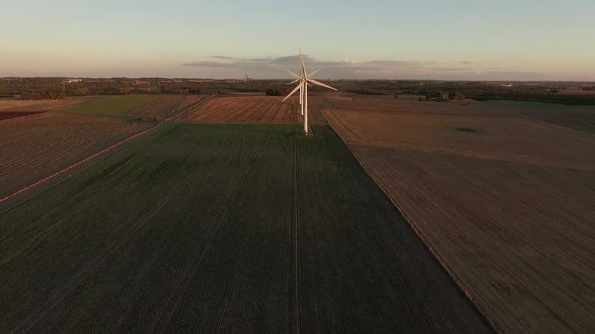 Windmills spinning in large fields