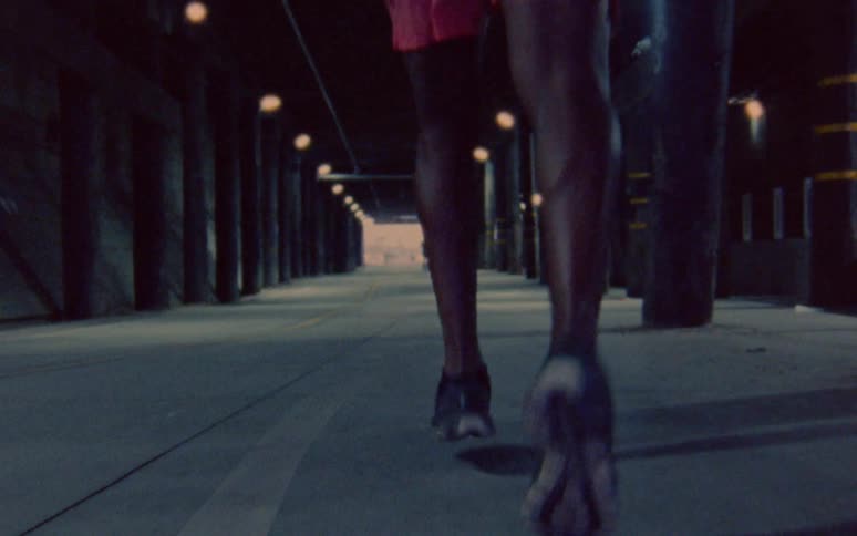 Man jogging through a tunnel in the city caught on vintage film