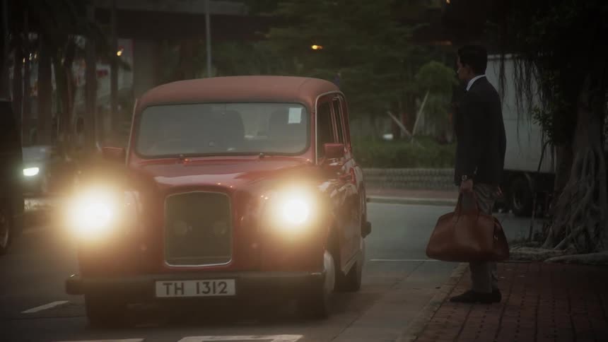 A man hails a taxi