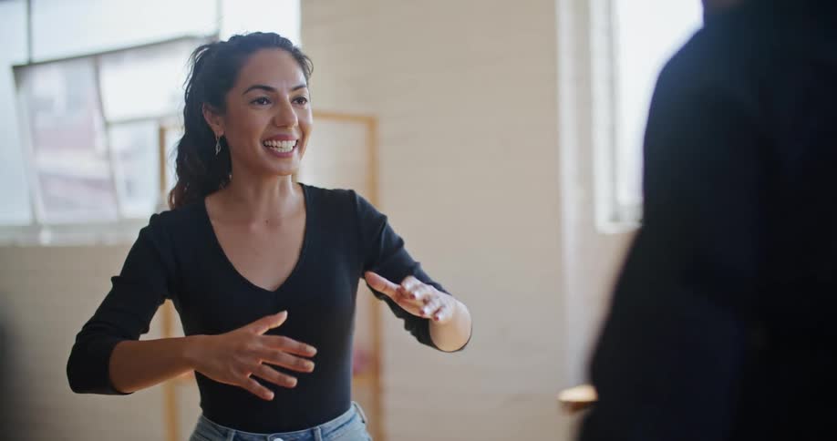 Two people are communicating together in a room