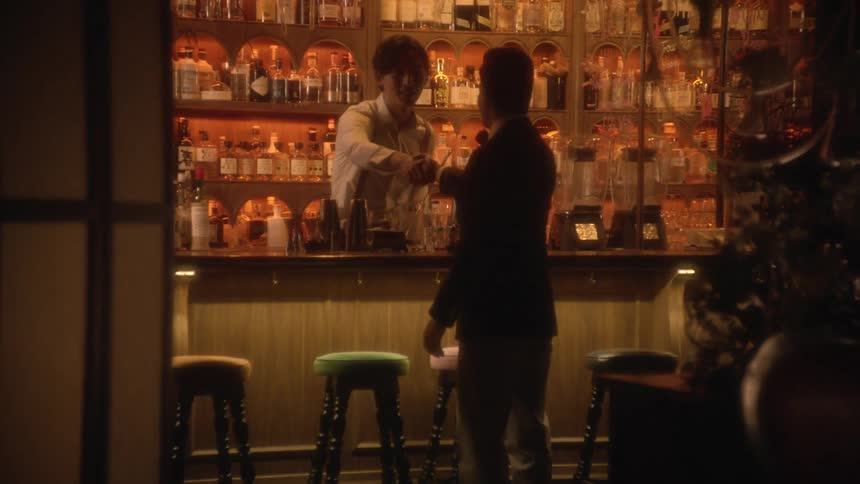 Man walks into bar to greet bartender then stand talking