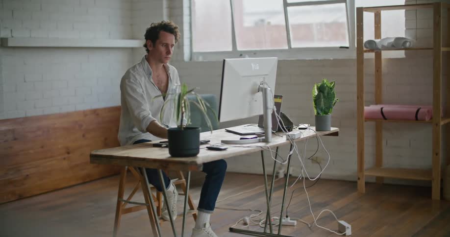 A man is working at his computer