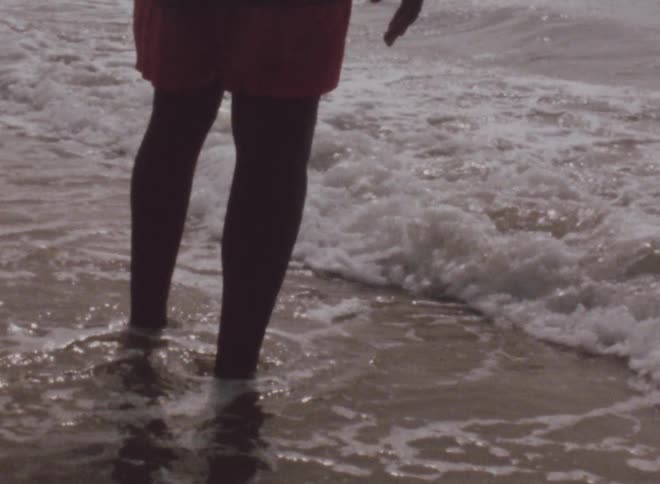 The water covers the persons feet