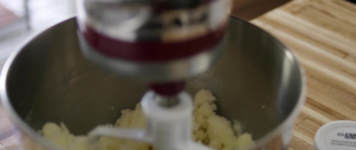 A mixing machine is working on a table