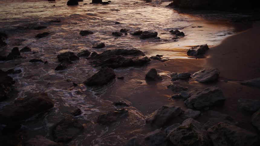 A view of waves crashing on the shore