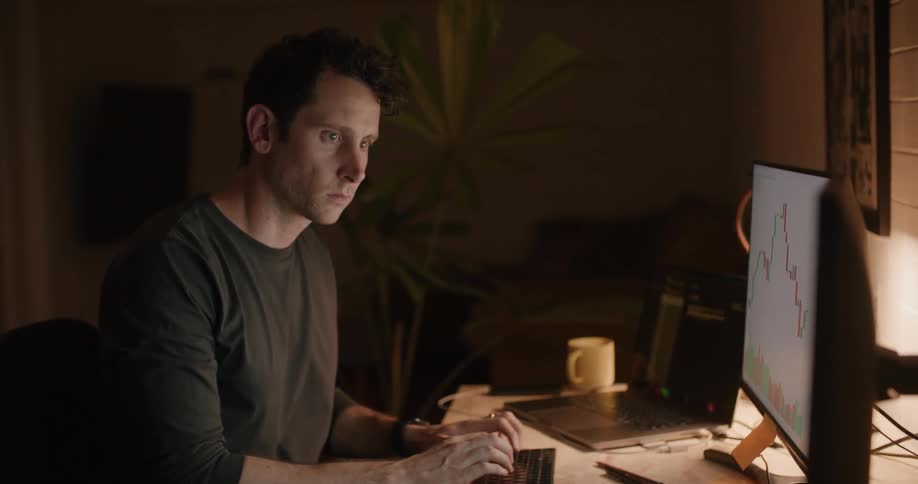 A man is working on the computer