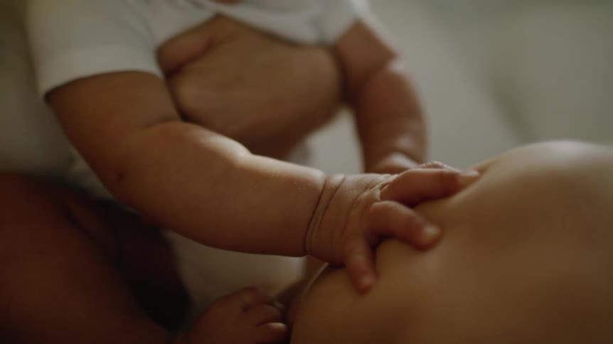 A mother is holding her son