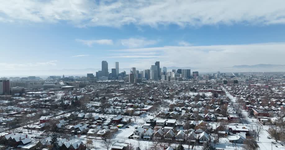Aerial view of a neighborhood in winter is displayed
