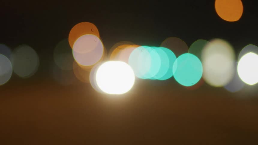 Blurred dots of various colors move toward the center as surface flows