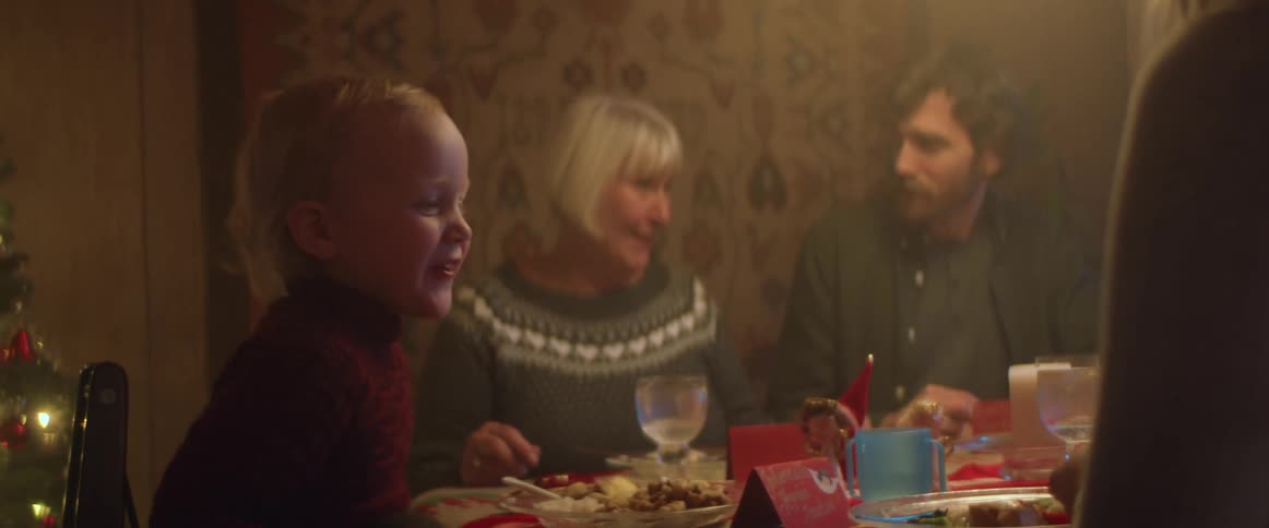 A family has dinner at the dining table