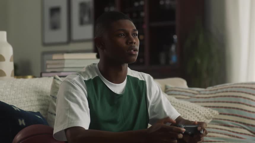 A man plays video games on his couch