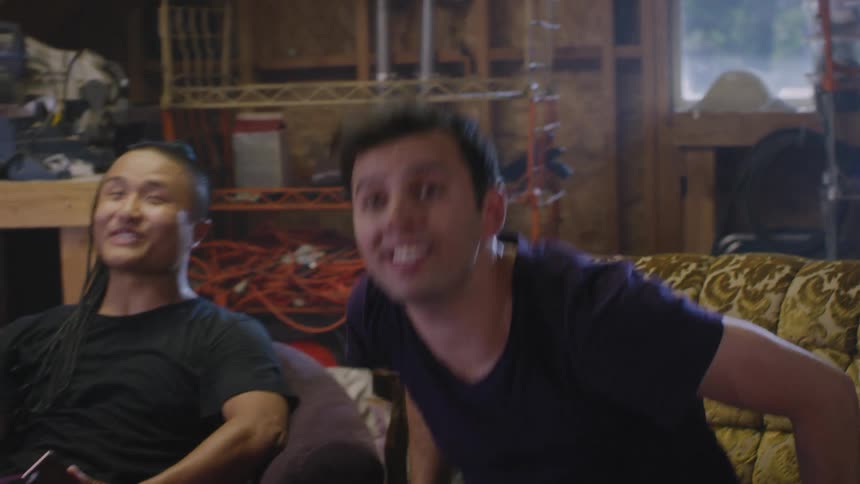 Three friends laugh and cheer together