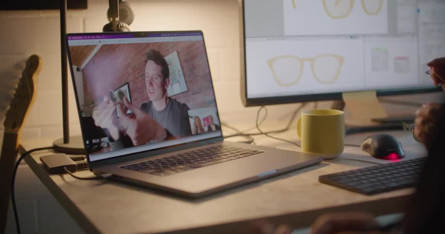 Two people talking on a computer