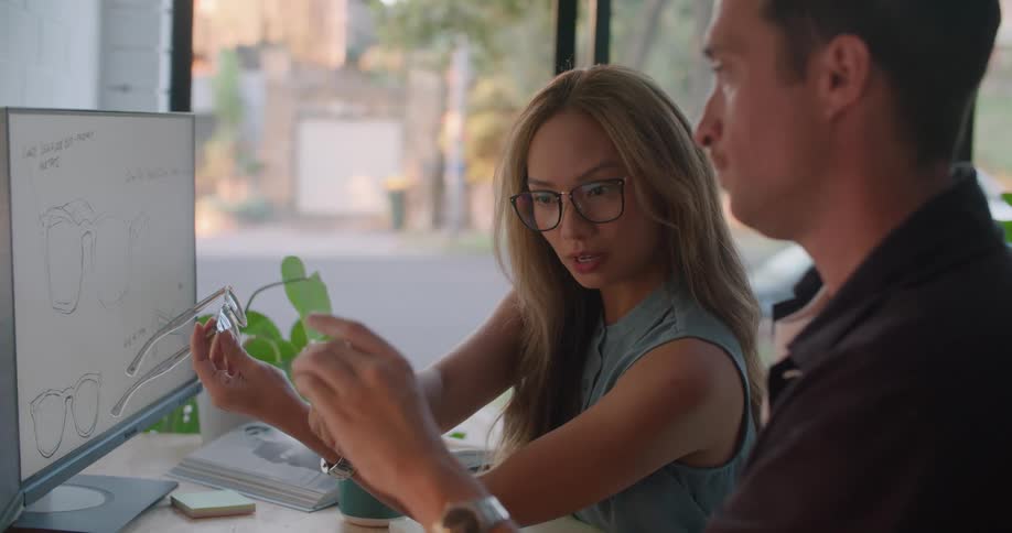 Two partners are collaborating on a sun glasses design