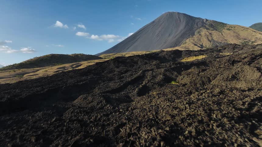The dirt hills lead to the mountain