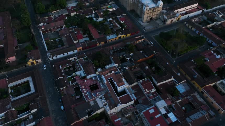 Cars travel on the streets in the city neighborhoods