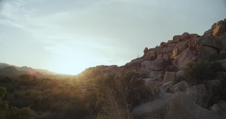 The sun is rising on the badlands