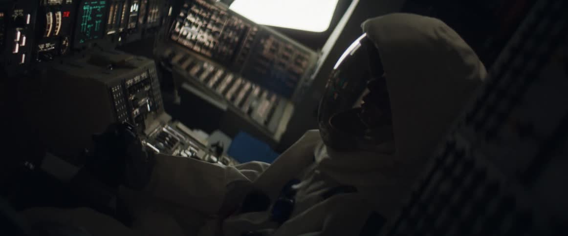 An astronaut holds on to a controller as her aircraft shakes uncontrollably