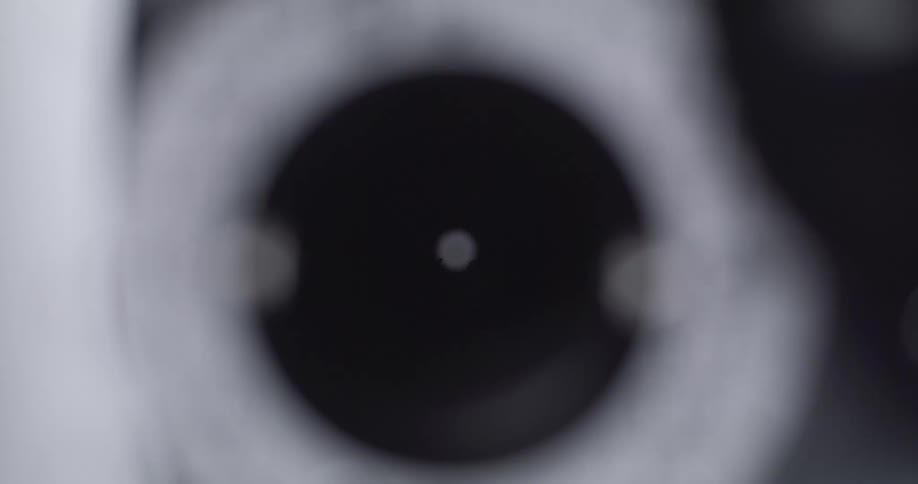 The phoropter is flipping lenses