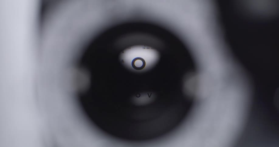 The eyeglass tester is flickering lenses