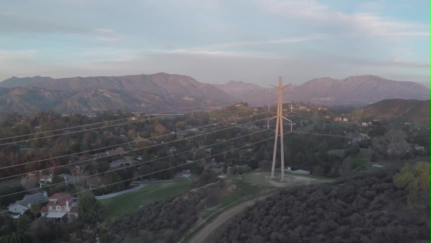 Power line towering over a community