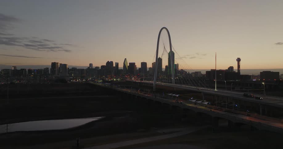 Heavy traffic heads out of downtown at dusk