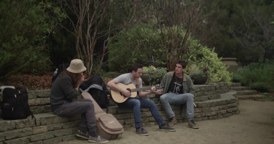 Three street performers playing as a group