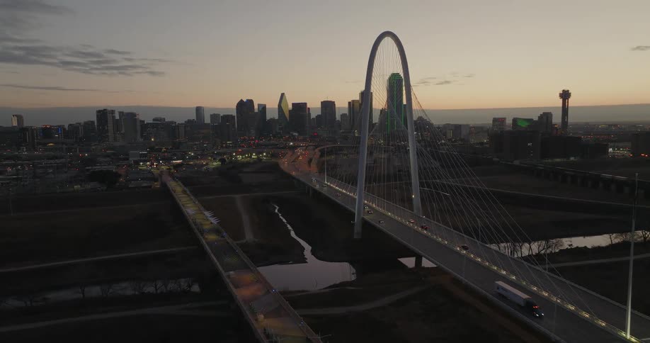 Heavy traffic passes down a bridge in and out of downtown