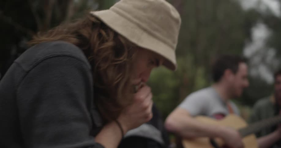 Group of people playing musical instruments outside